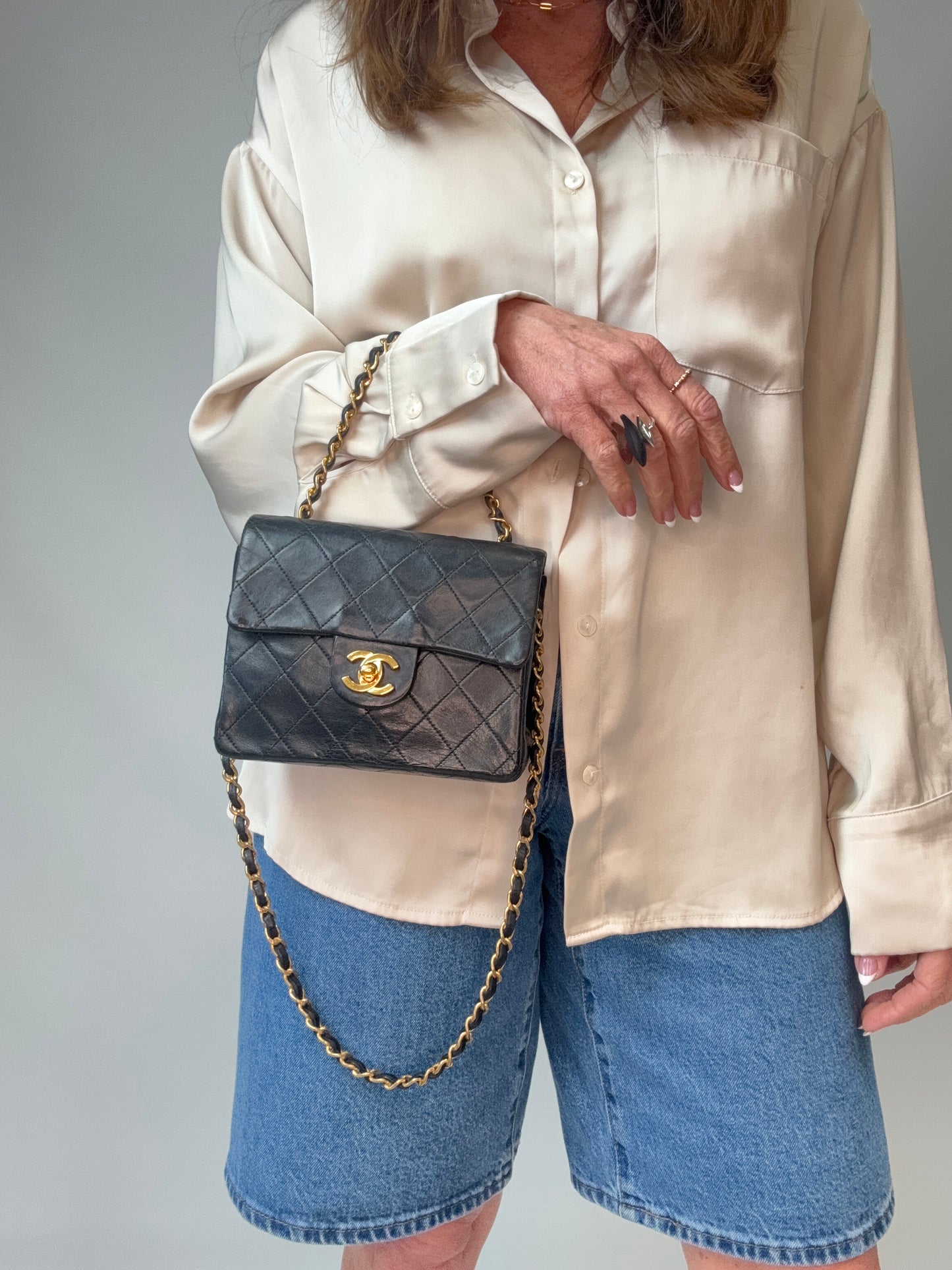 Chanel Quilted Lambskin Mini Square Flap Bag modeled 3