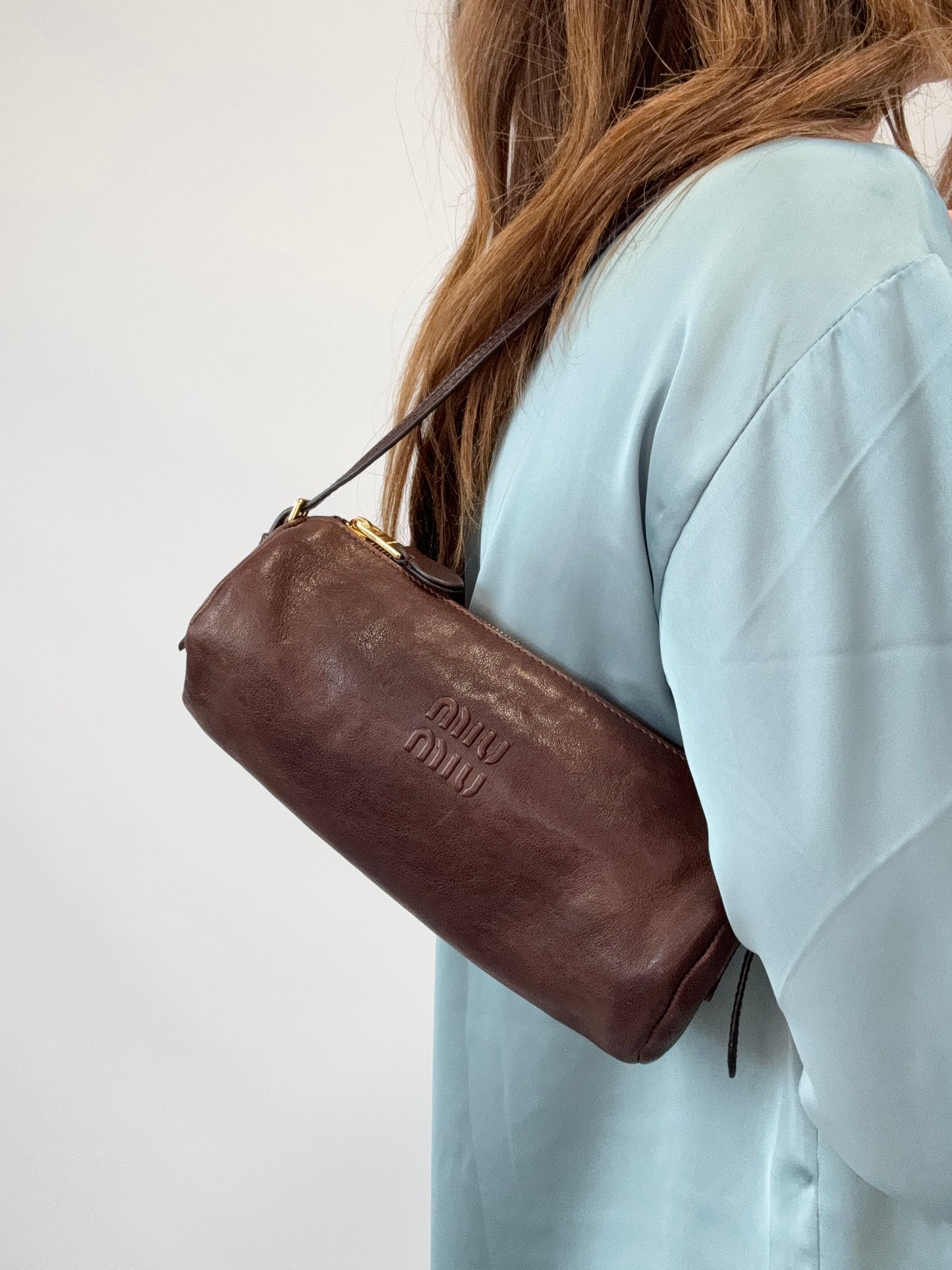 Miu Miu Nappa Leather Aviator Mini Pouch modeled