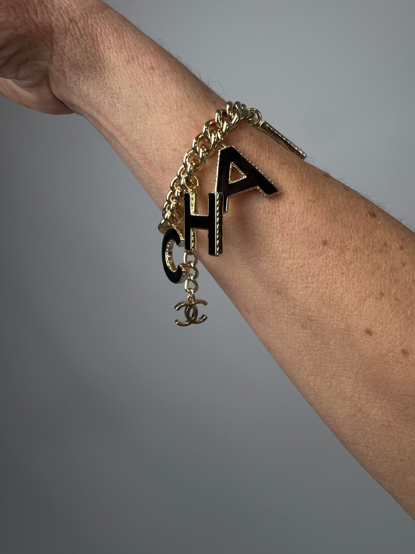 Chanel Logo Charm Bracelet — Black & White Enamel