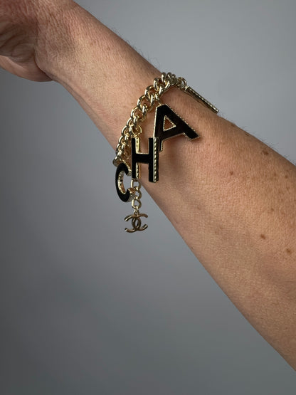 Chanel Logo Charm Bracelet — Black & White Enamel