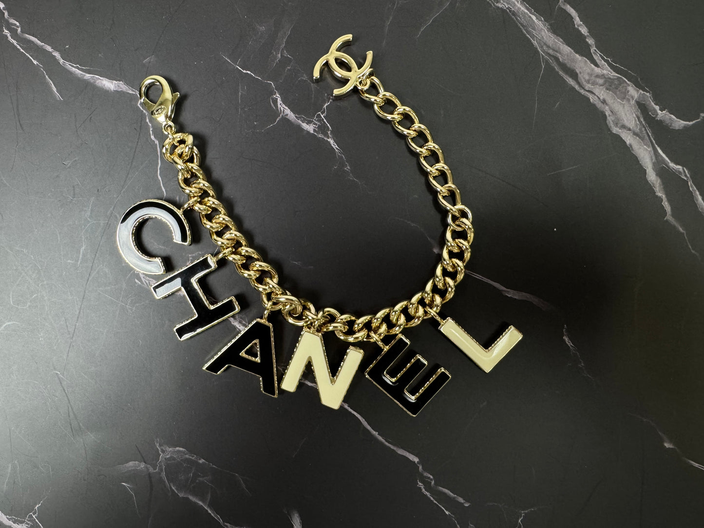 Chanel Logo Charm Bracelet — Black & White Enamel