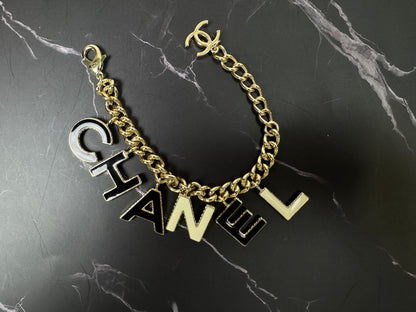 Chanel Logo Charm Bracelet — Black & White Enamel