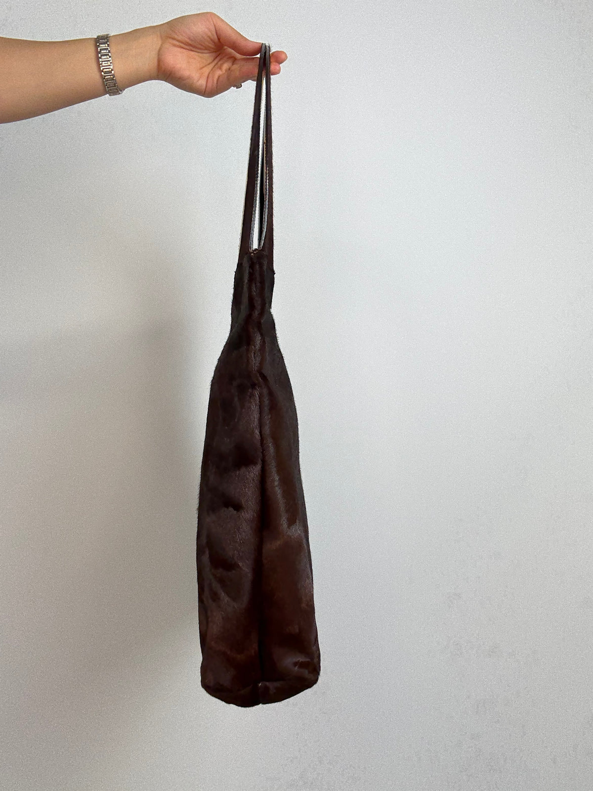 Gucci by Tom Ford oversized shoulder bag in brown pony hair from the Fall/Winter 1996 runway collection. Left Side of Bag 