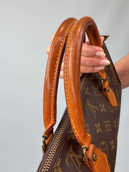 Louis Vuitton Monogram Triangle Sac