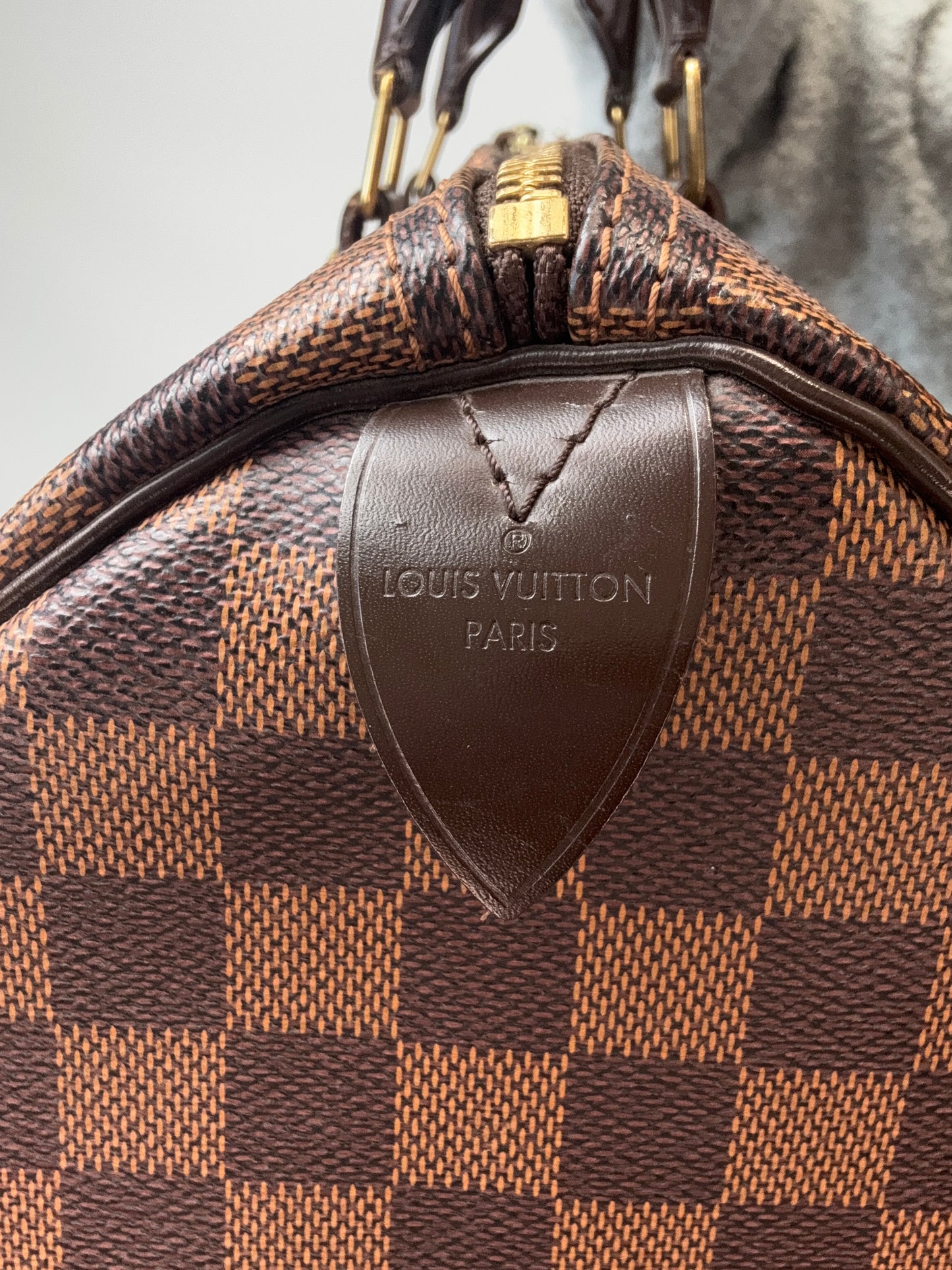 Louis Vuitton Damier Ebene Speedy 35 leather logo tag