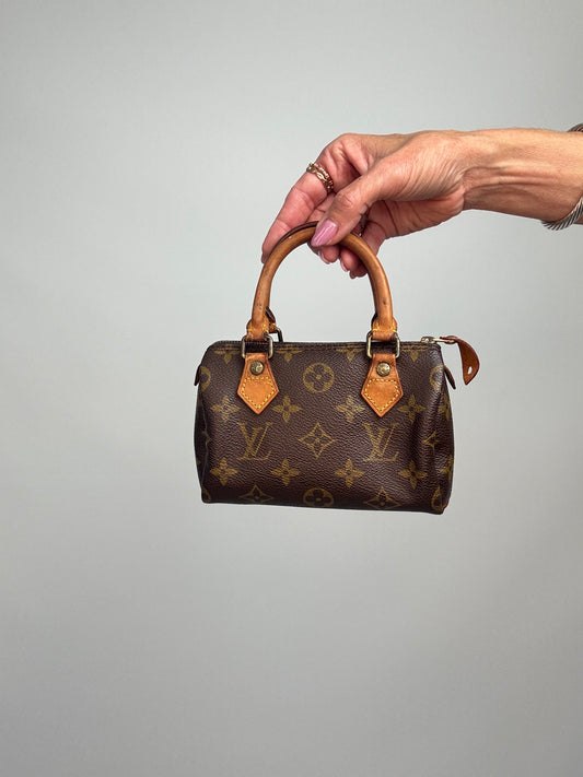 Louis Vuitton Mini Speedy HL bag in Monogram with shoulder strap, dated 1991. Front of Bag | TheStilStyle