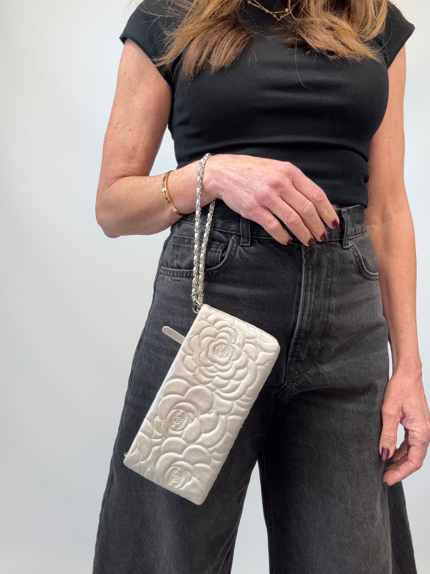 Chanel Camellia Silver VIP Pochette modeled 3