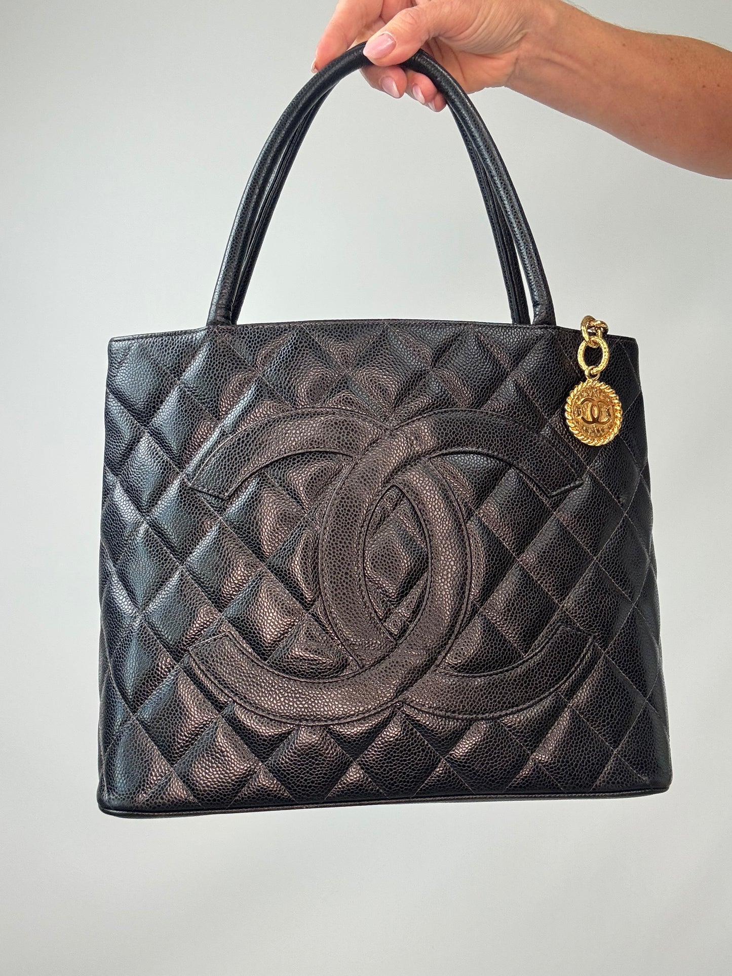 Chanel Caviar Quilted Medallion Tote front of handbag