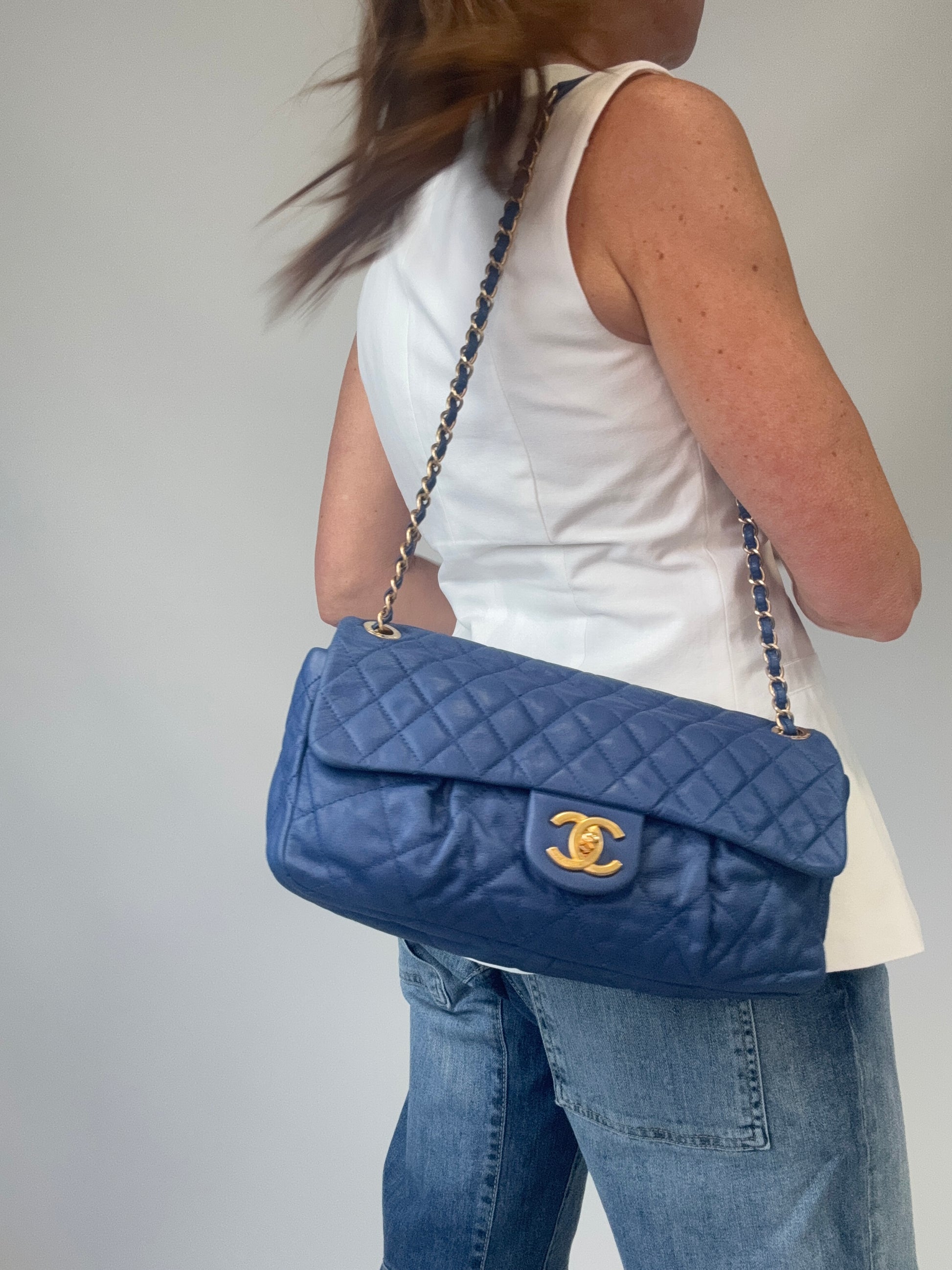 Chanel Classic Quilted Leather Flap Bag in Blue modeled 2