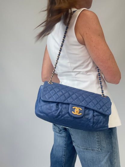 Chanel Classic Quilted Leather Flap Bag in Blue modeled 2