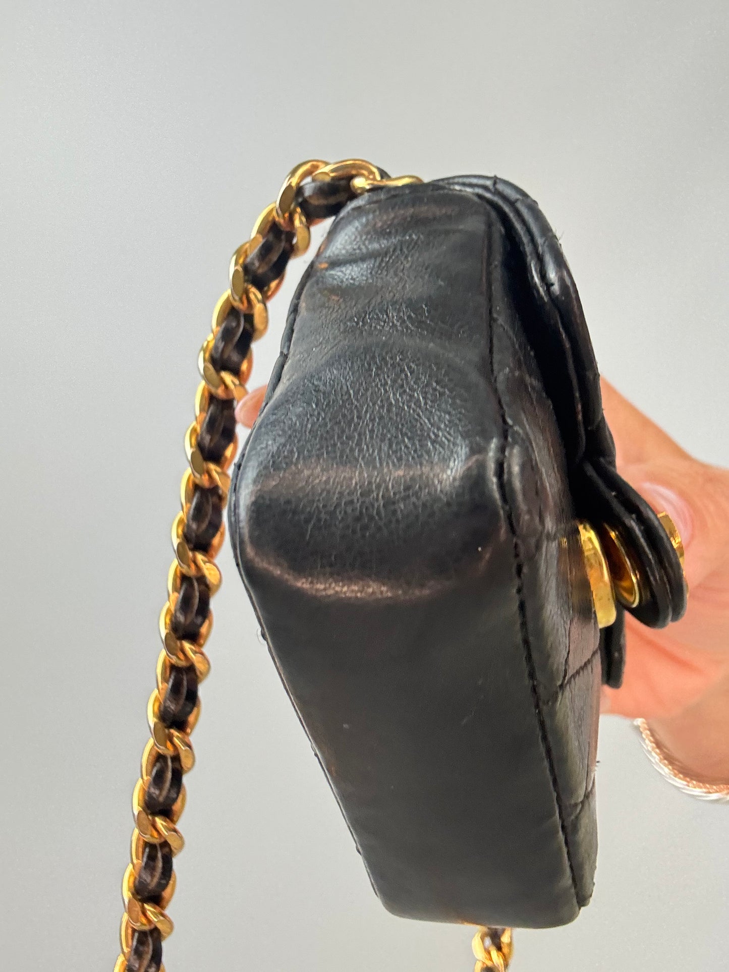 Chanel Micro Quilted Flap Bag left side bottom corner