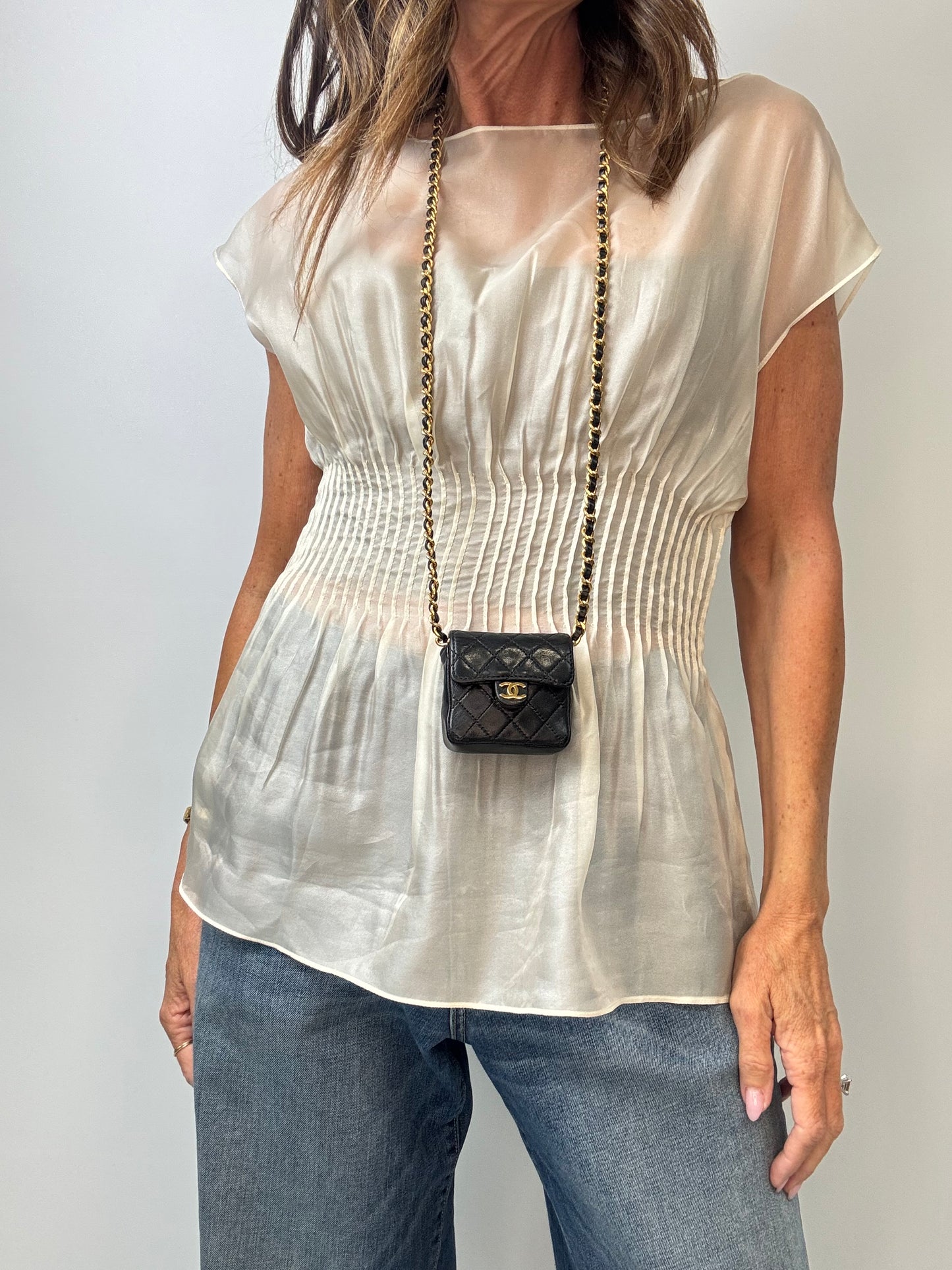 Chanel Micro Quilted Flap Bag modeled 3