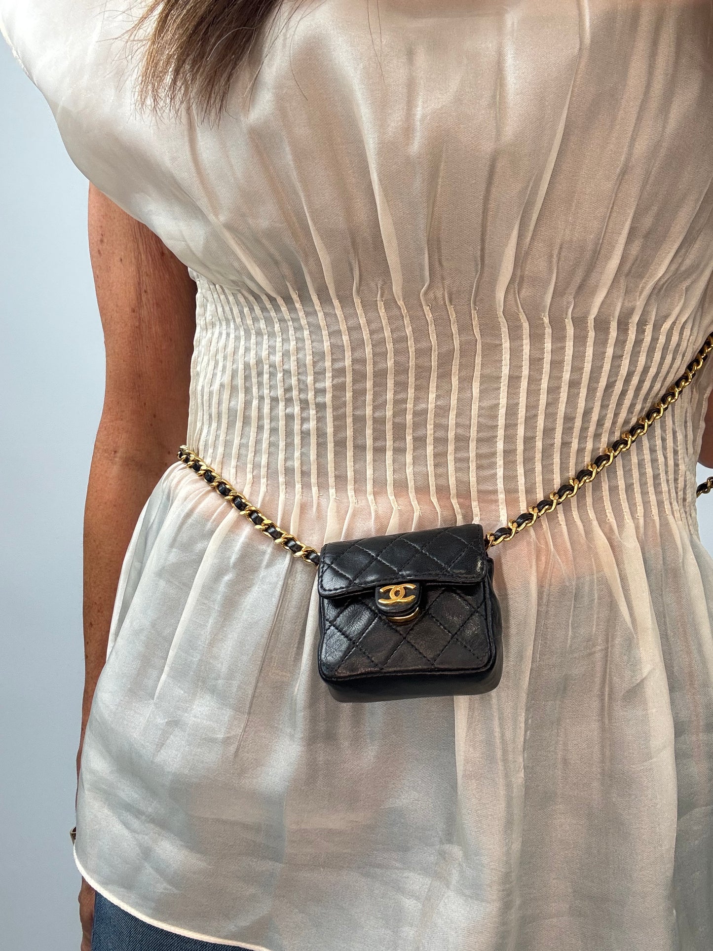 Chanel Micro Quilted Flap Bag modeled 4