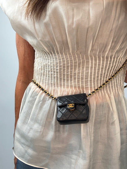 Chanel Micro Quilted Flap Bag modeled 4