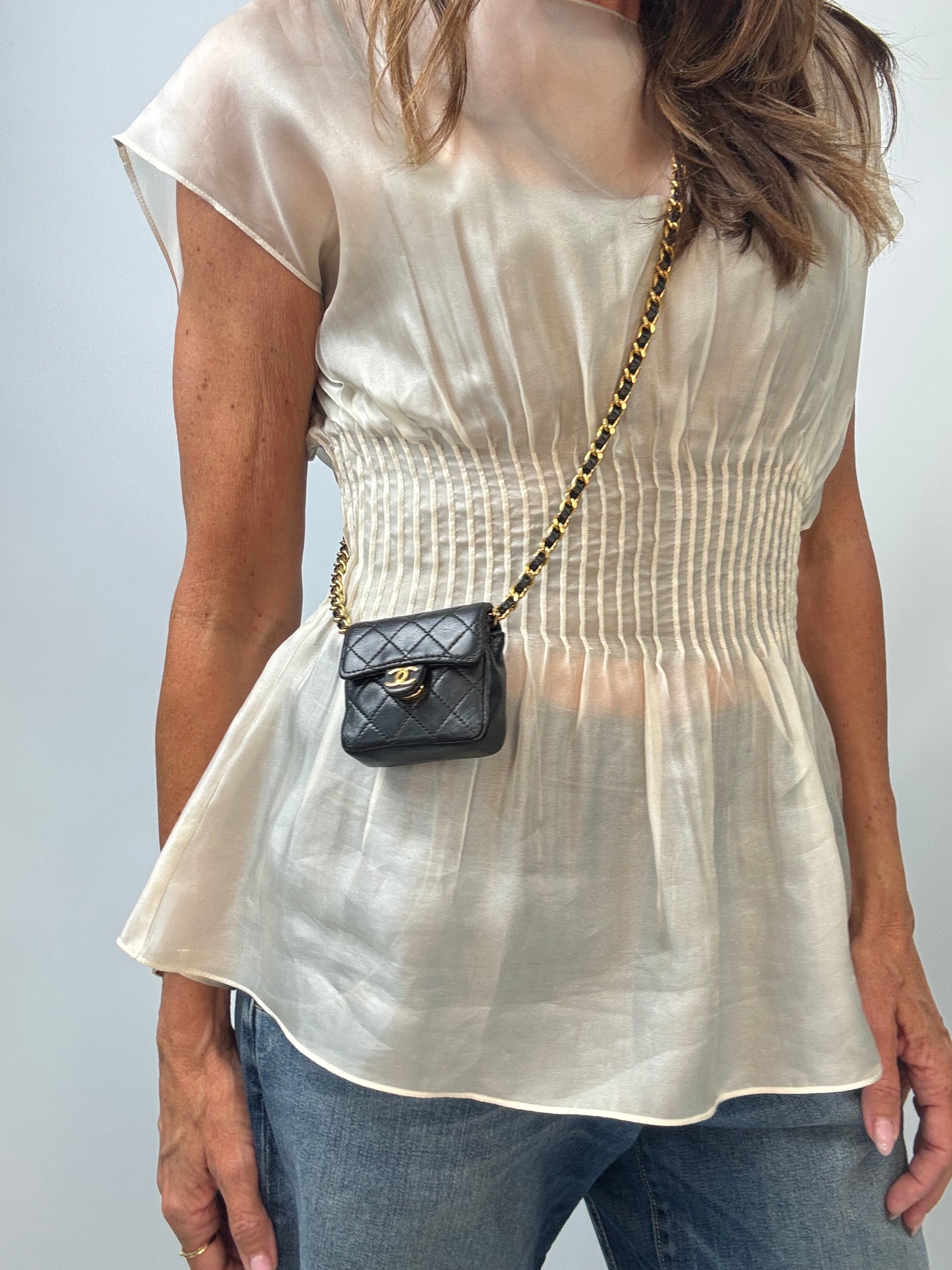 Chanel Micro Quilted Flap Bag modeled