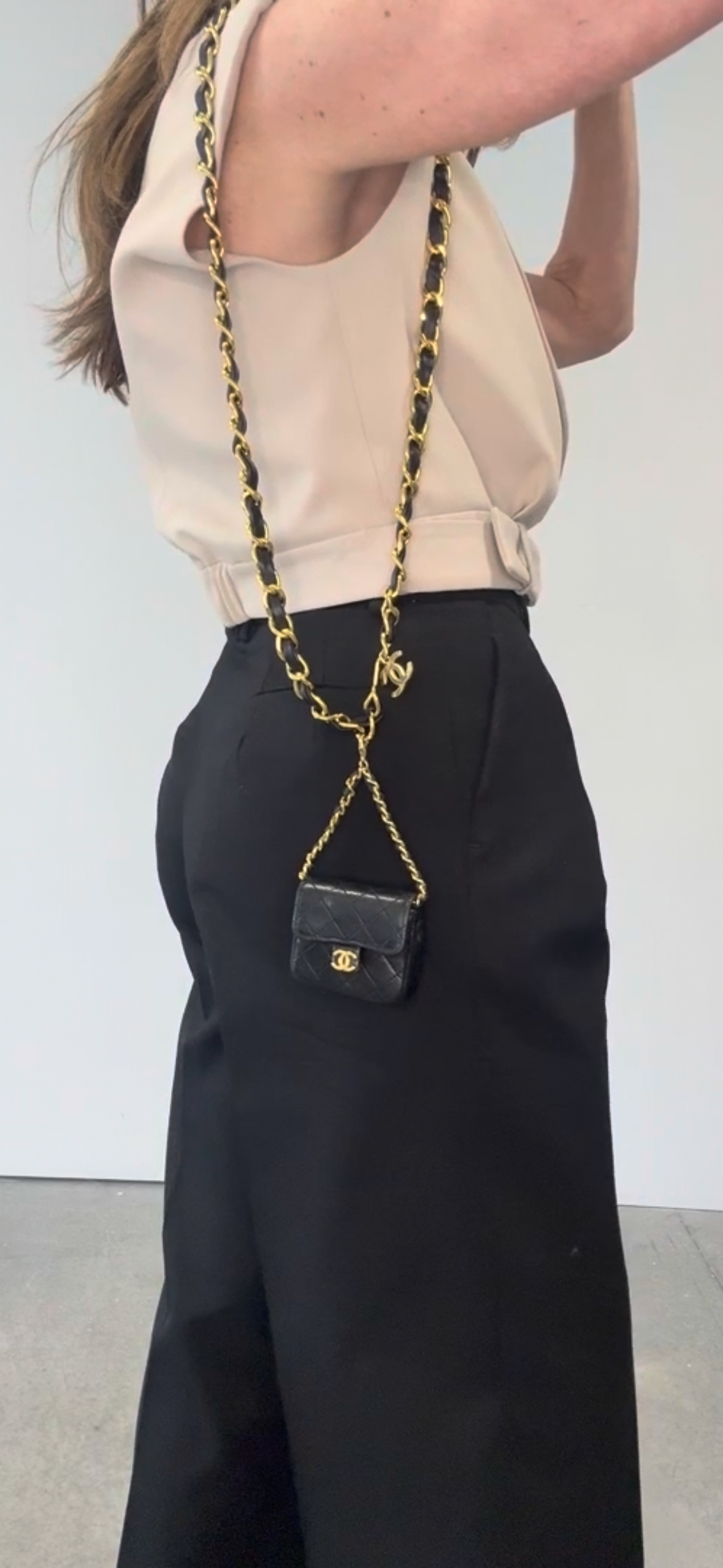 Chanel Micro Quilted Lambskin Flap Chain Belt Bag modeled 4