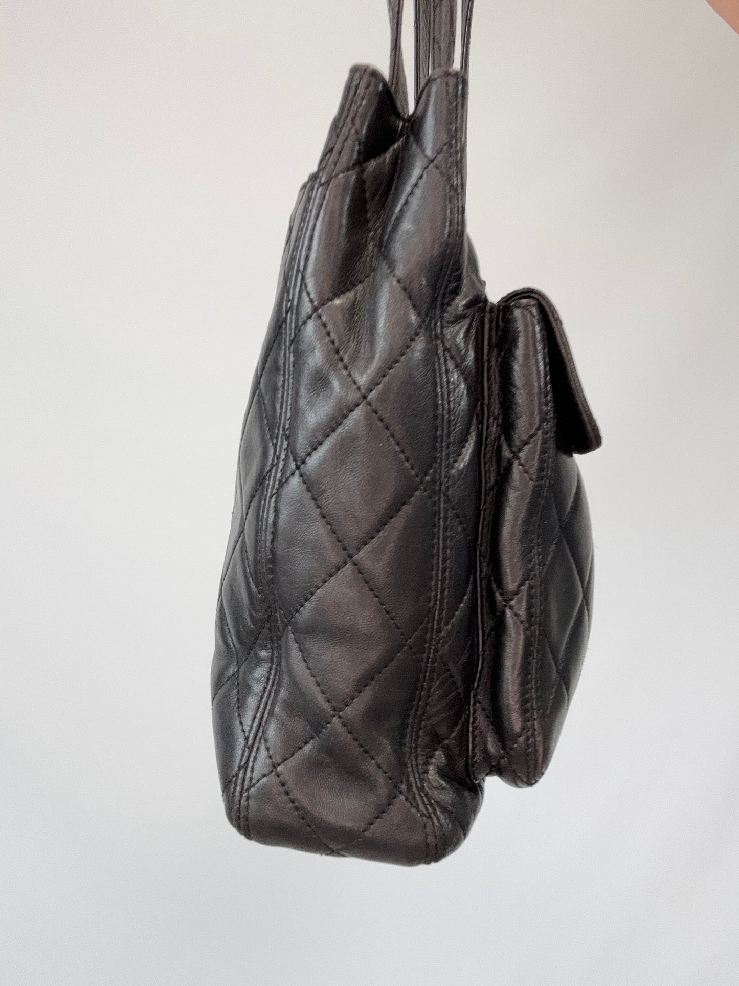 Chanel Quilted Double Pocket Turn Lock Tote left side of handbag