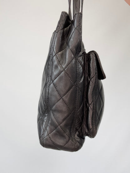 Chanel Quilted Double Pocket Turn Lock Tote left side of handbag