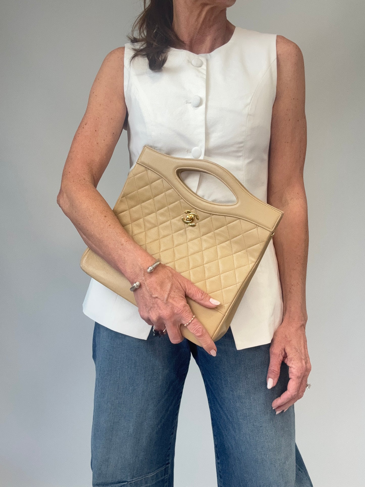 Chanel Quilted Lambskin 31 Shopping Tote in Beige modeled 2