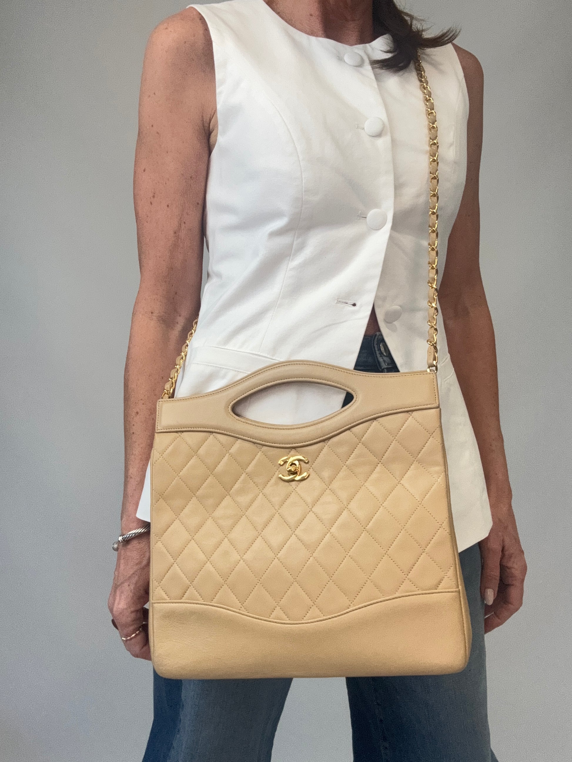 Chanel Quilted Lambskin 31 Shopping Tote in Beige modeled 4