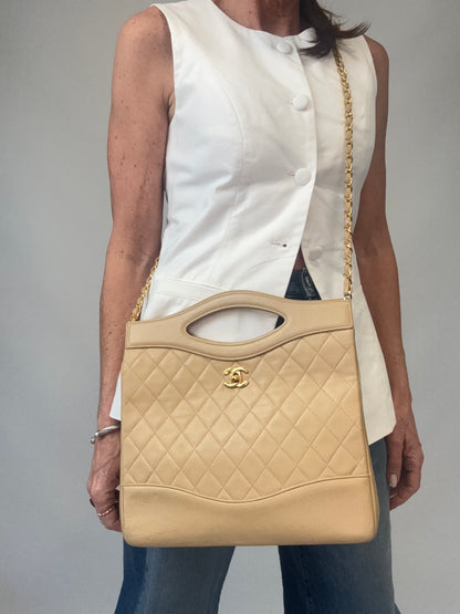 Chanel Quilted Lambskin 31 Shopping Tote in Beige modeled 4