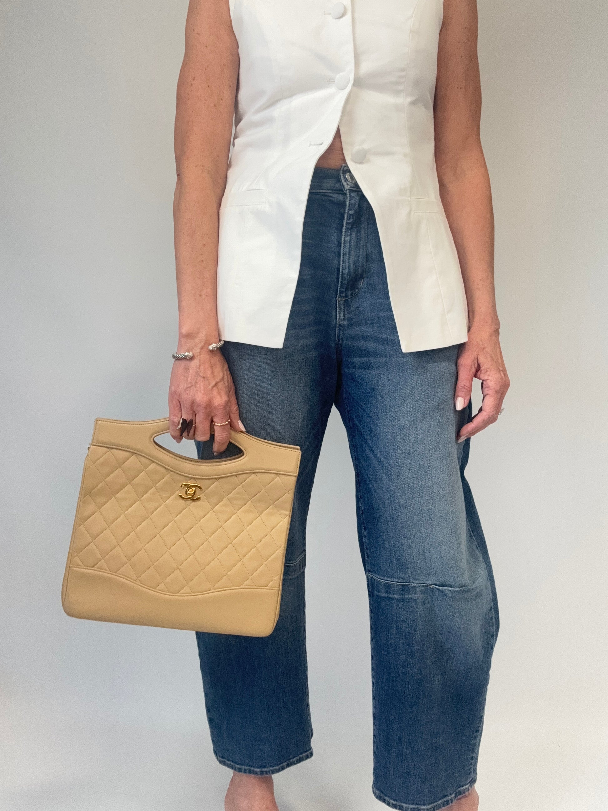 Chanel Quilted Lambskin 31 Shopping Tote in Beige modeled