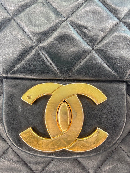 Chanel Quilted Lambskin Jumbo Single Flap Bag close up of gold hardware