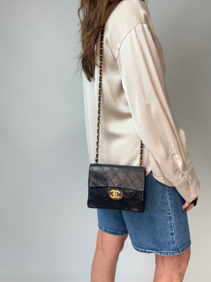 Chanel Quilted Lambskin Mini Square Flap Bag modeled 2