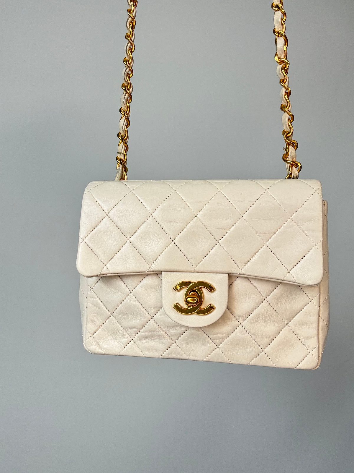 Chanel Quilted White Lambskin Mini Classic Square Flap Bag front of handbag