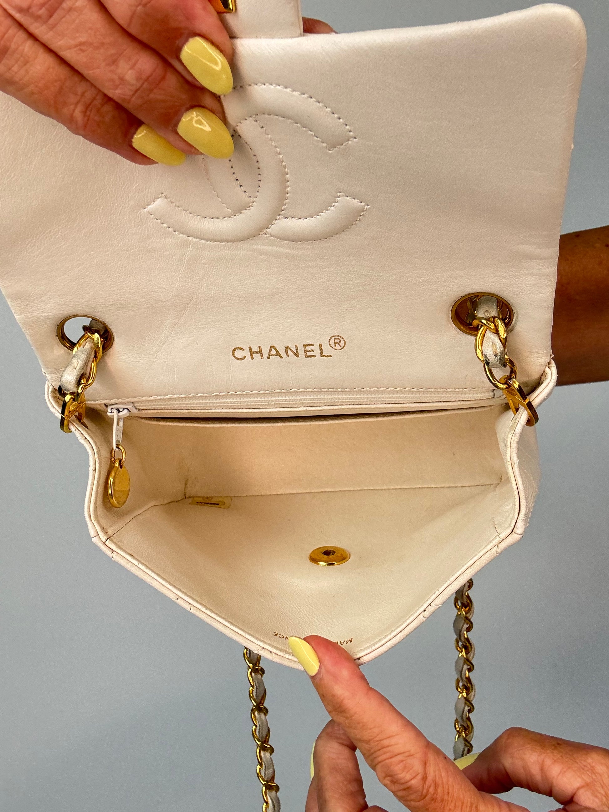 Chanel Quilted White Lambskin Mini Classic Square Flap Bag interior of handbag
