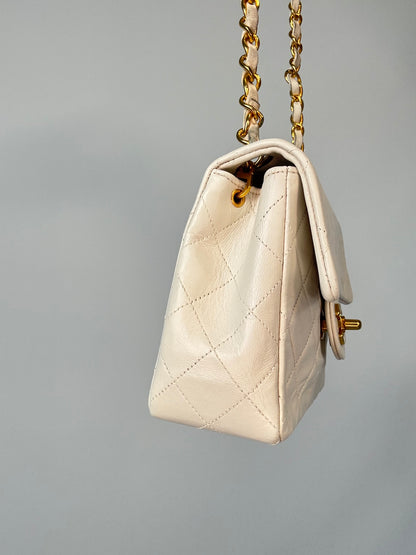 Chanel Quilted White Lambskin Mini Classic Square Flap Bag  left side