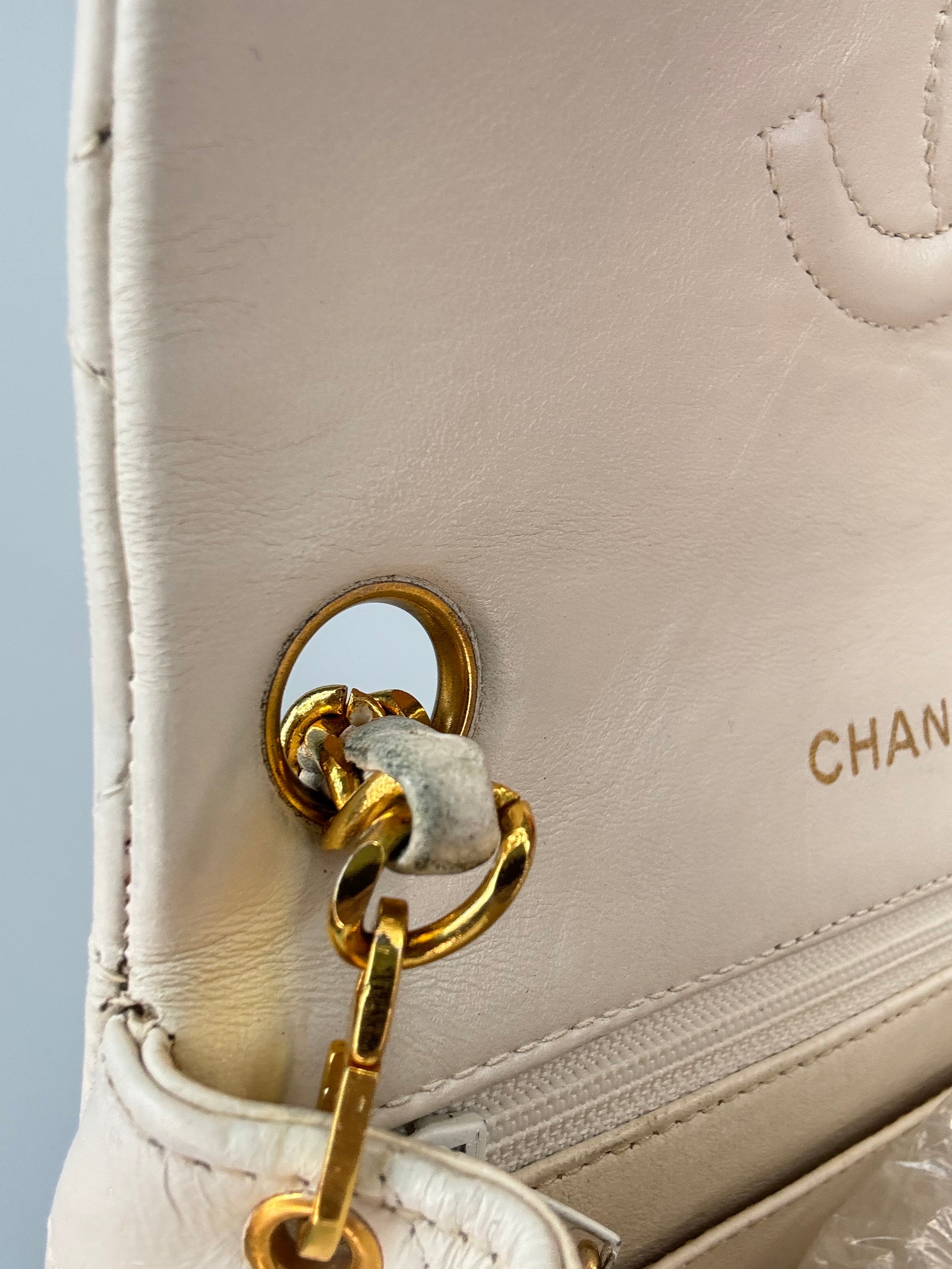 Chanel Quilted White Lambskin Mini Classic Square Flap Bag gold strap hardware left side