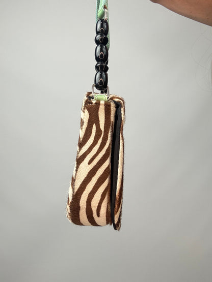 Dior Zebra Print Pony Hair Malice Flap Shoulder Bag left side of handbag