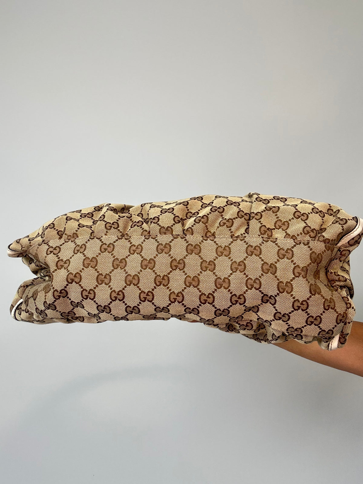 Gucci GG Canvas Abbey D-RIng Hobo Bag bottom of handbag