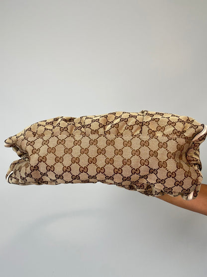 Gucci GG Canvas Abbey D-RIng Hobo Bag bottom of handbag