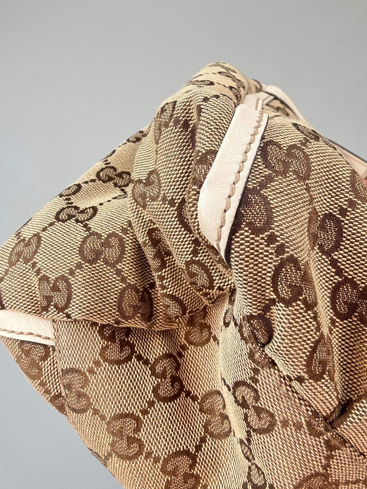 Gucci GG Canvas Abbey D-RIng Hobo Bag front left bottom corner