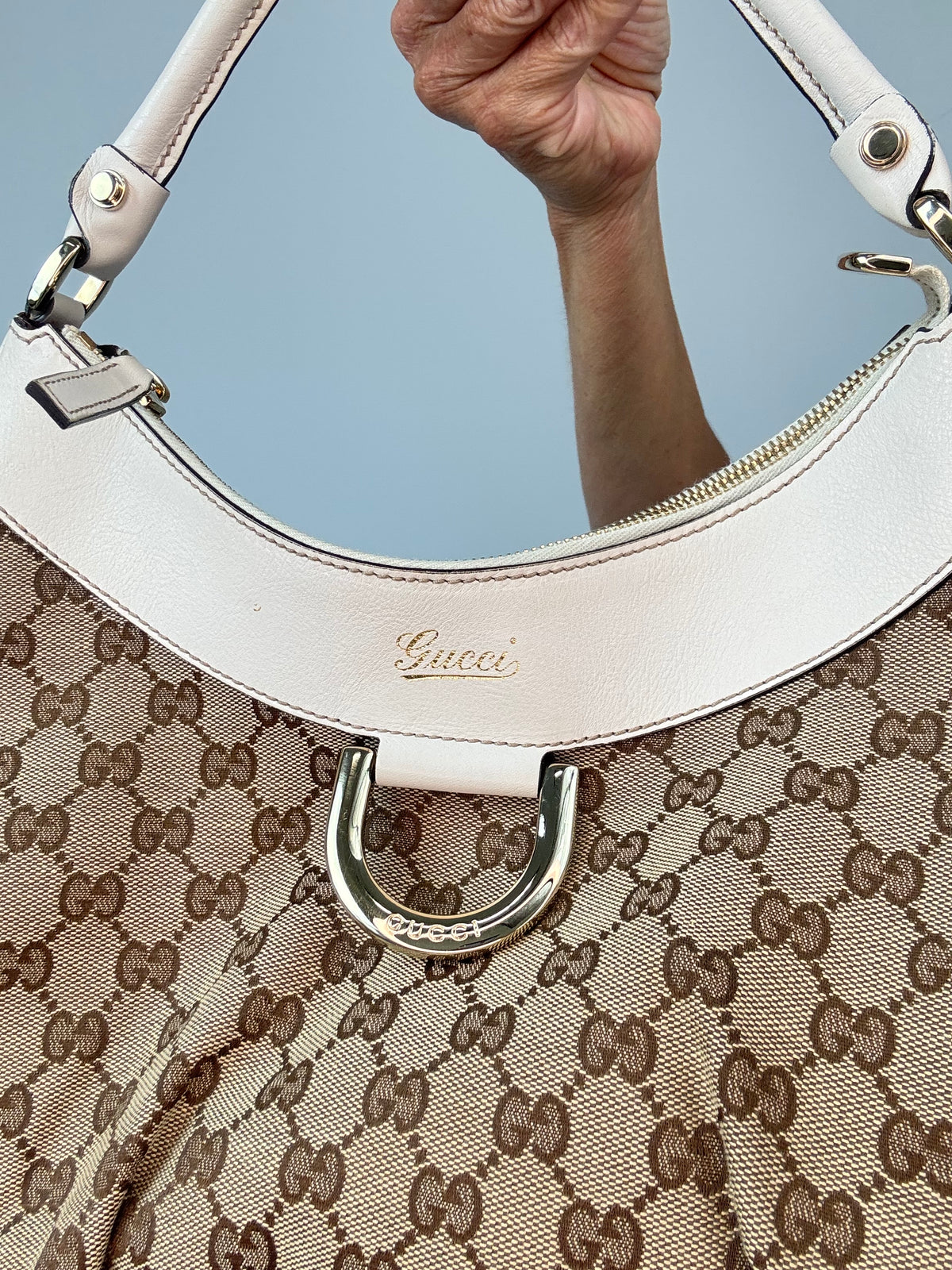 Gucci GG Canvas Abbey D-RIng Hobo Bag front leather, logo and d-ring