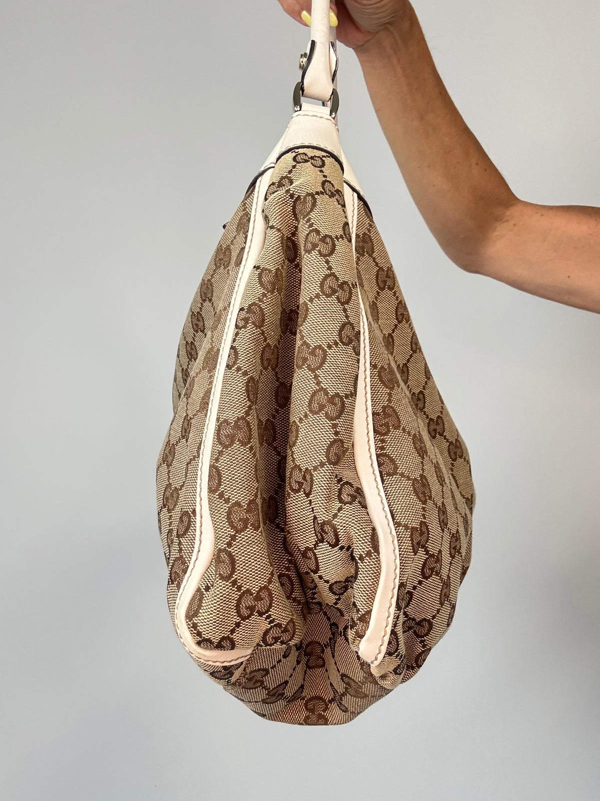Gucci GG Canvas Abbey D-RIng Hobo Bag left side of handbag
