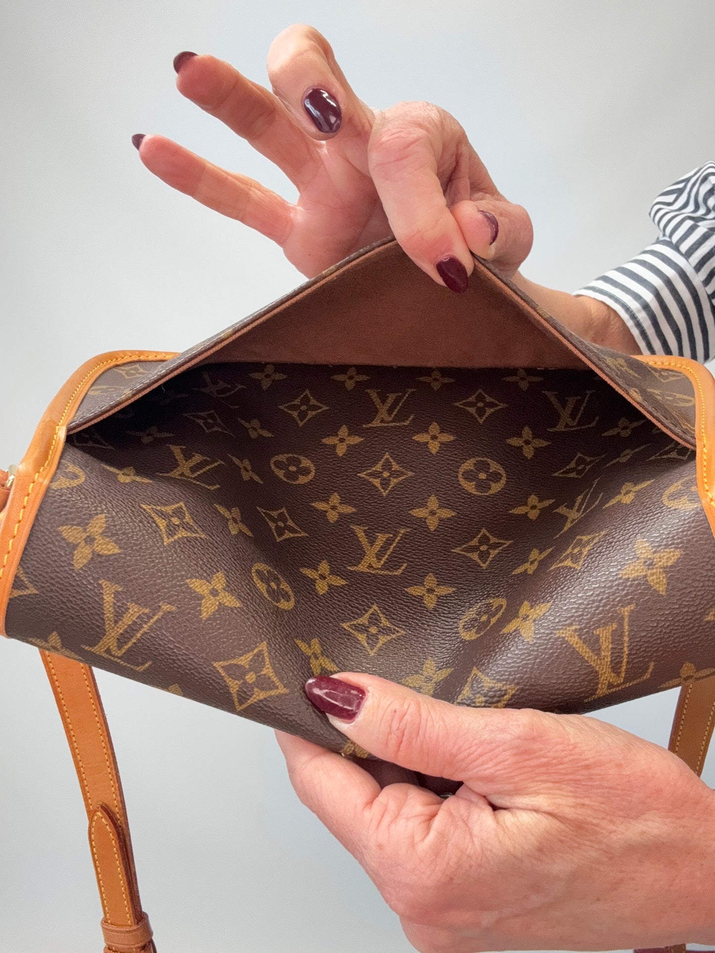 LOUIS VUITTON Monogram Canvas Sologne interior of exterior back pocket