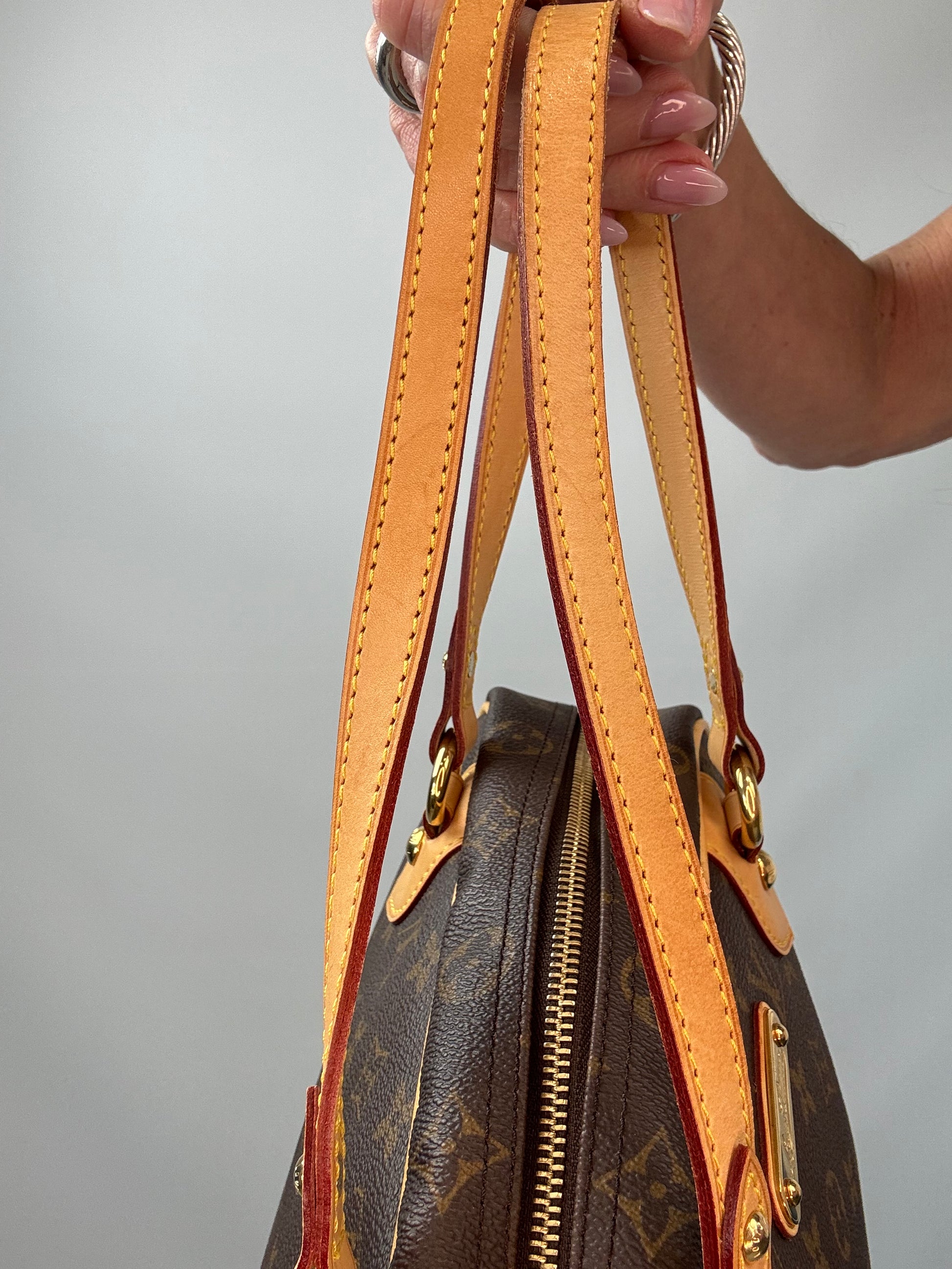 Louis Vuitton Monogram Montorgueil PM left side of both straps
