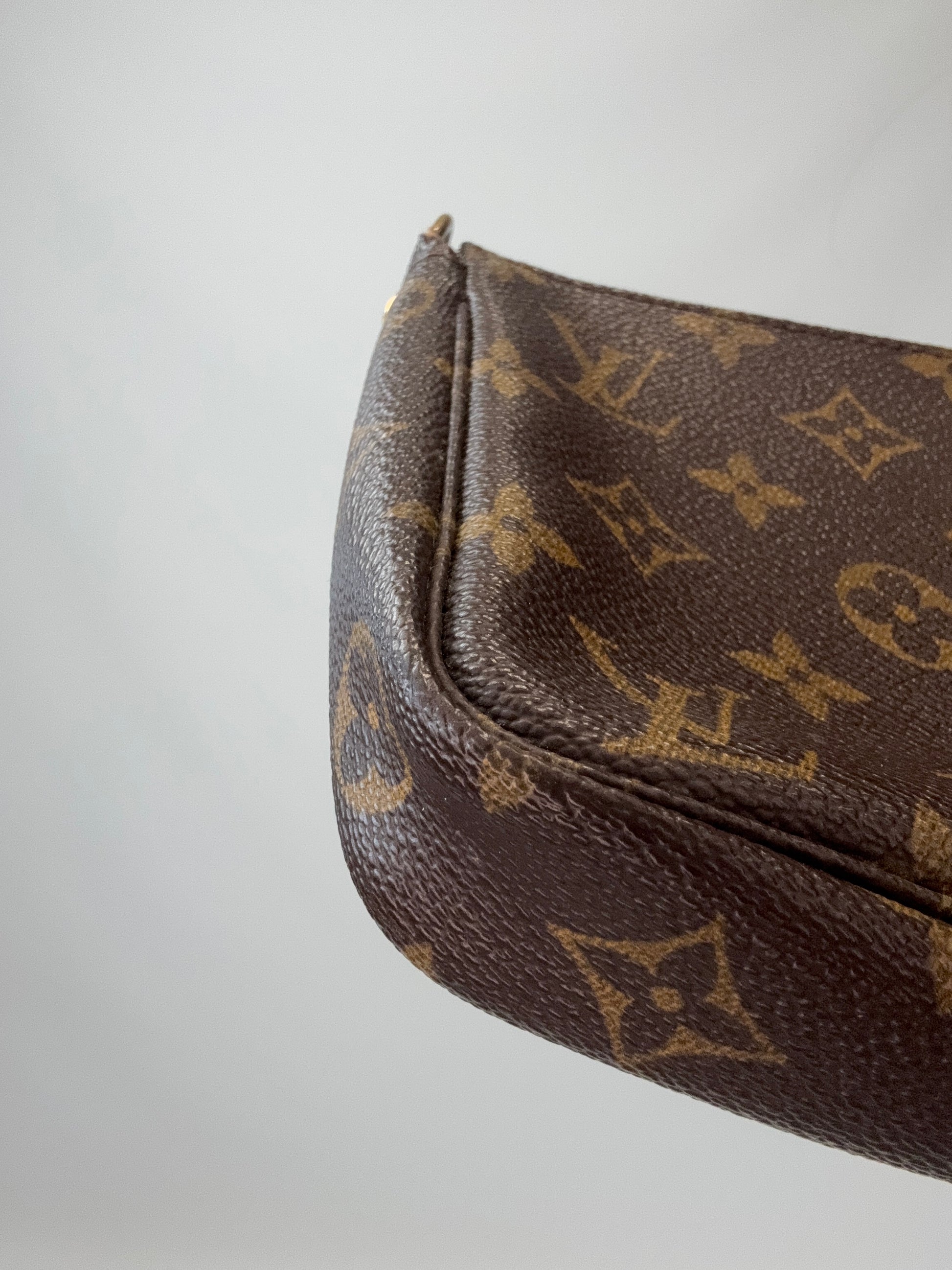 Louis Vuitton Monogram Pochette back left bottom corner