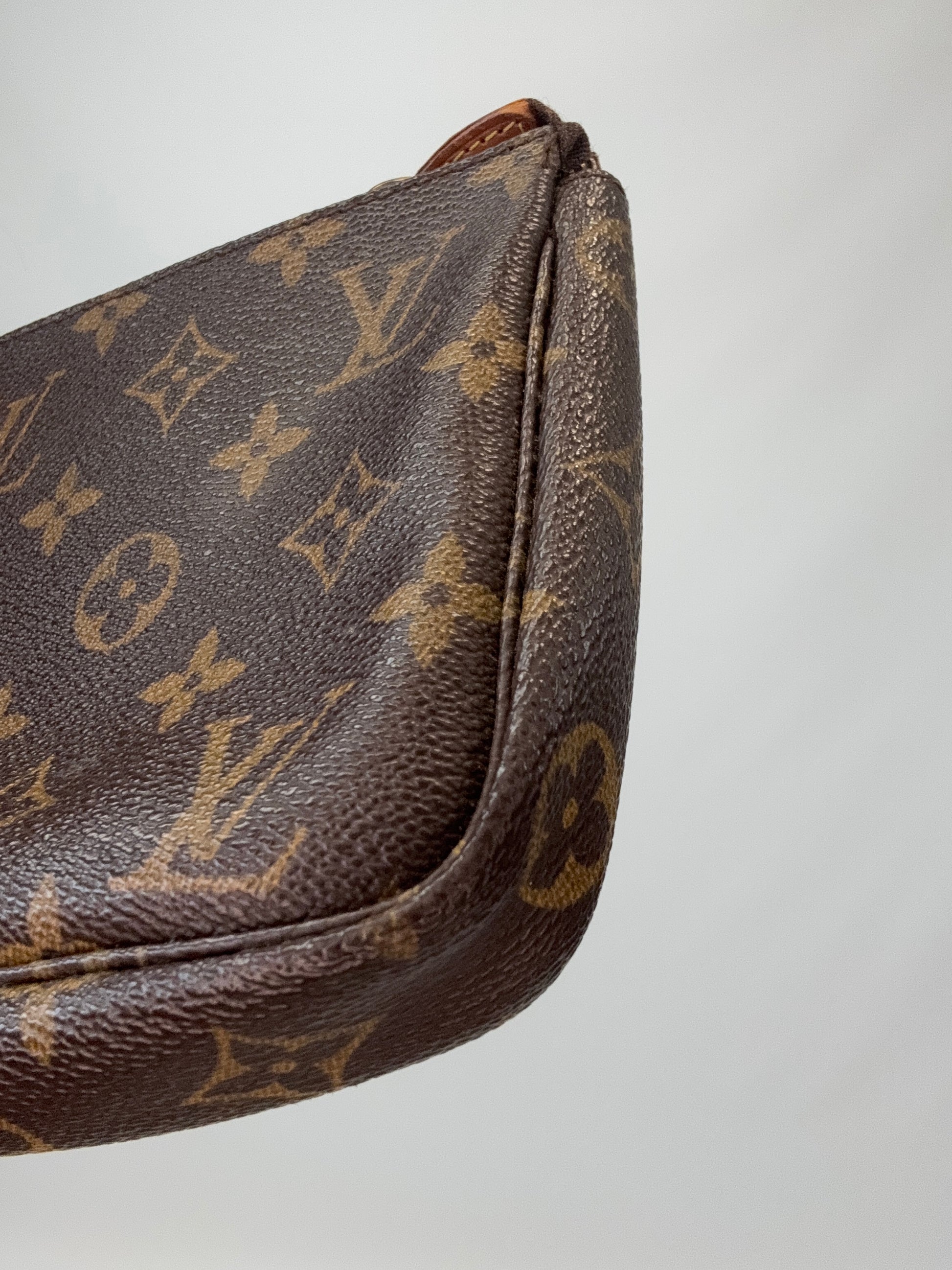 Louis Vuitton Monogram Pochette back right bottom corner