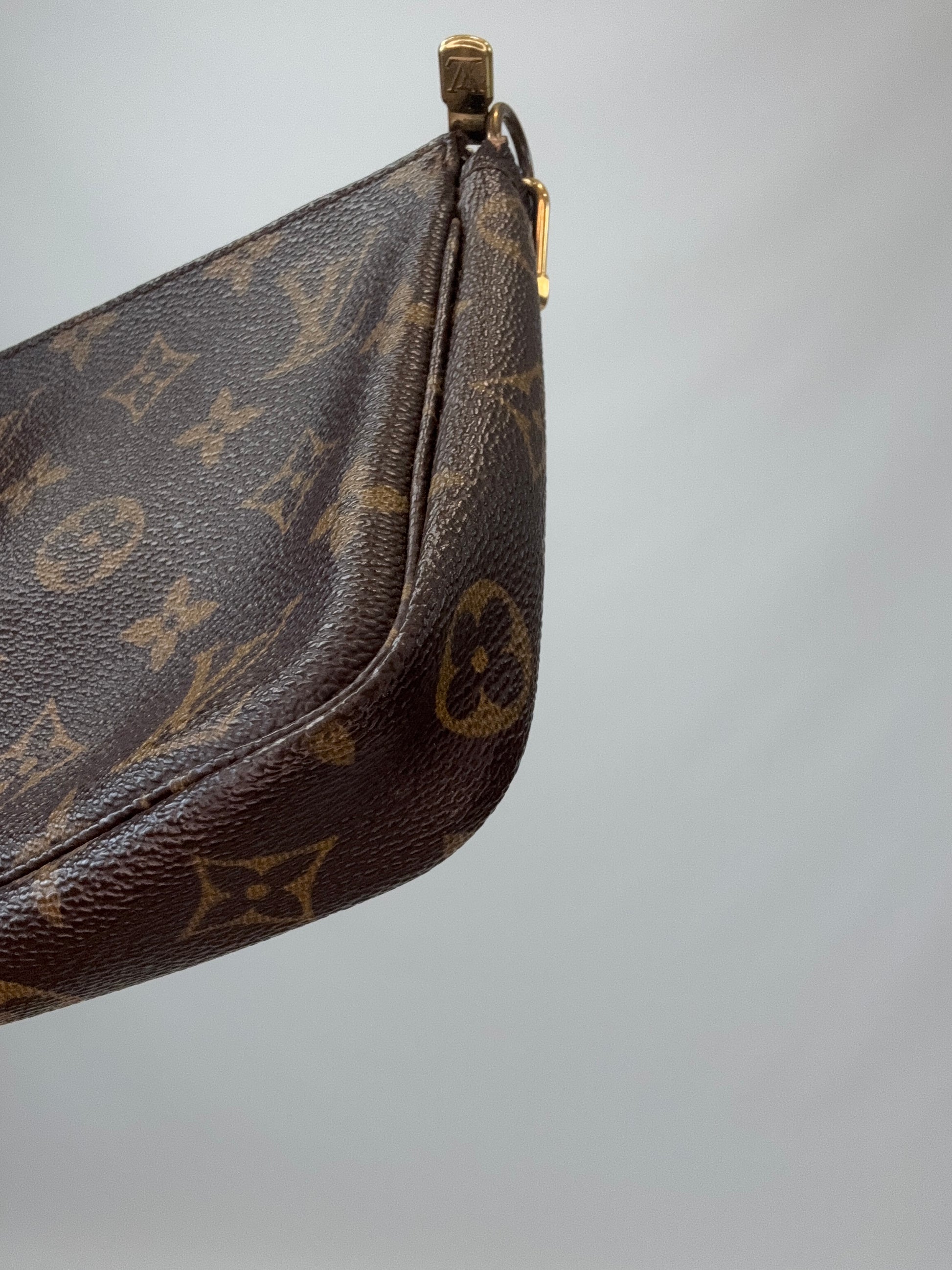 Louis Vuitton Monogram Pochette front right bottom corner