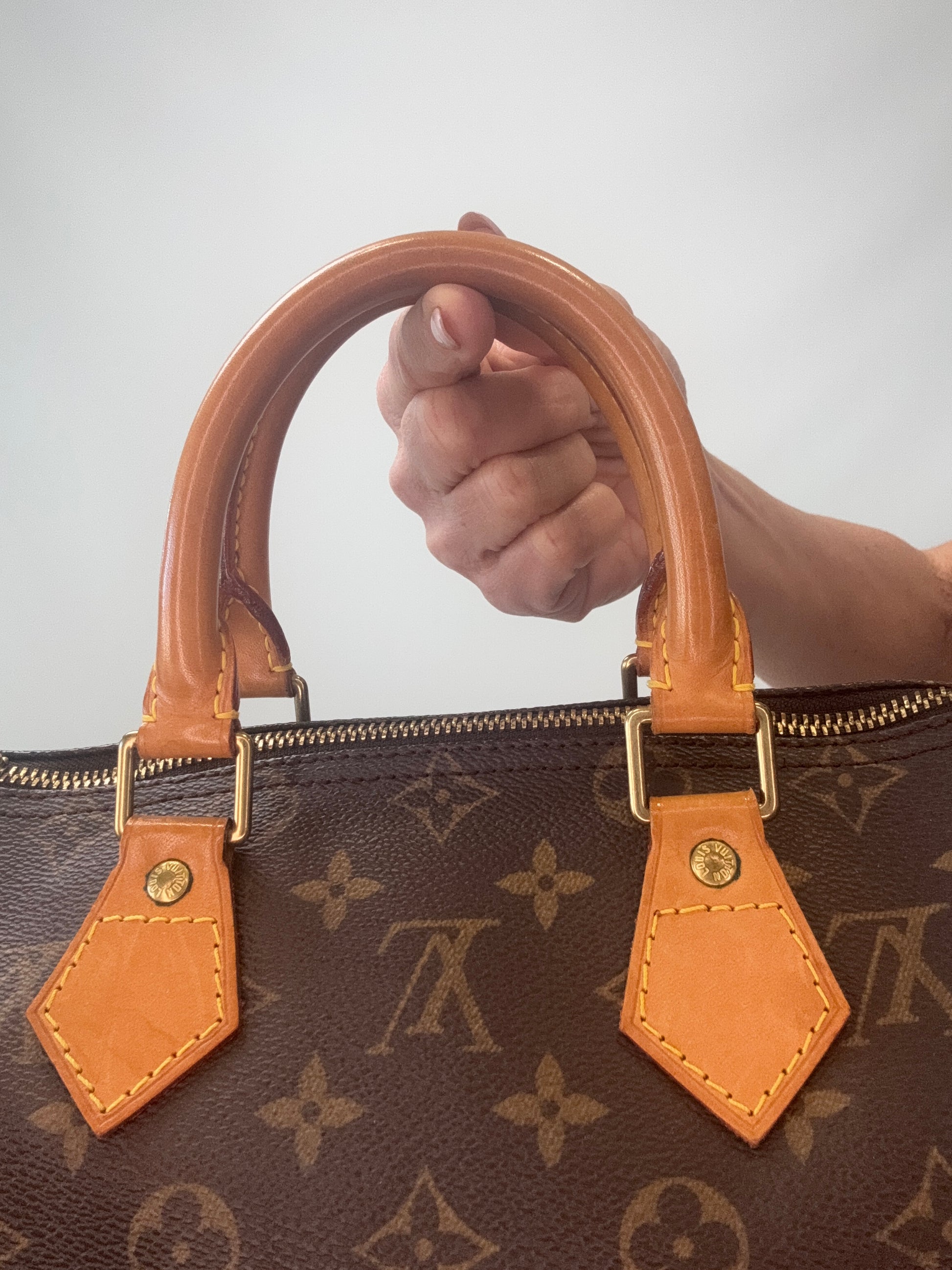 Louis Vuitton Monogram Speedy 25  back  of top handles