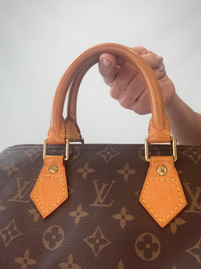 Louis Vuitton Monogram Speedy 25  front of top handles