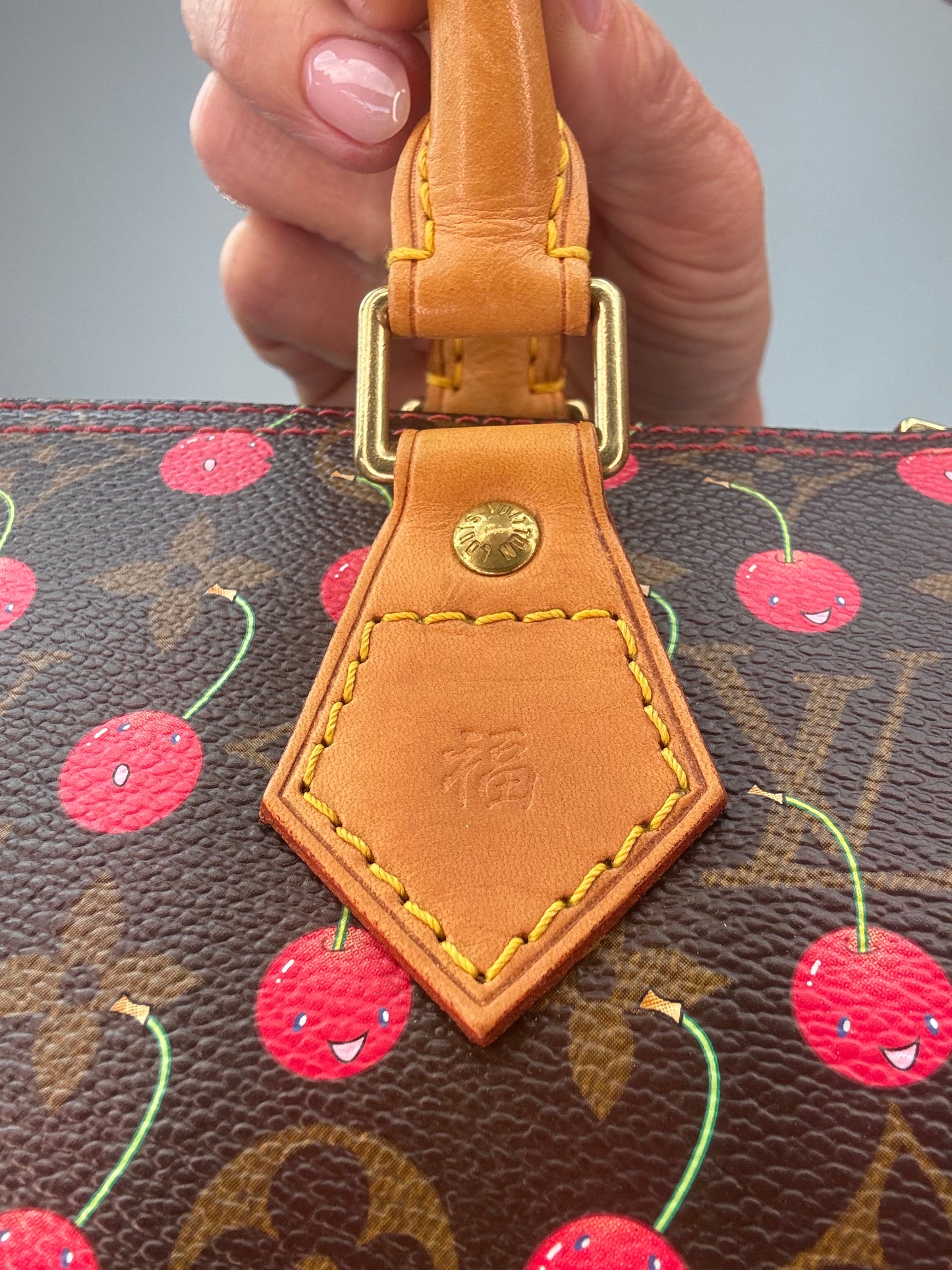 Louis Vuitton Takashi Murakami Monogram Cerises Speedy 25 stamp on handle attachment