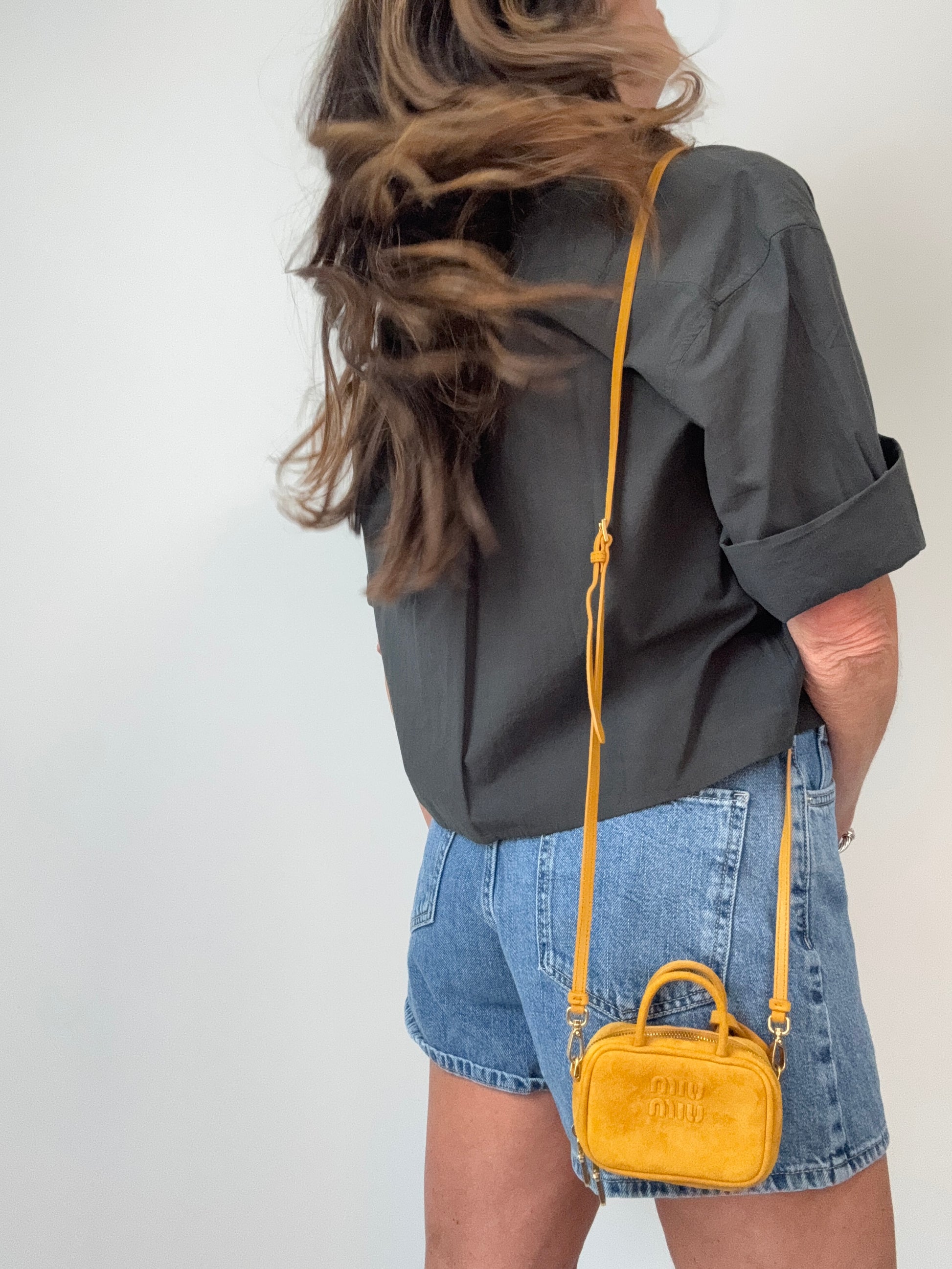Miu Miu Beau Micro Suede Bag - Whiskey modeled 2