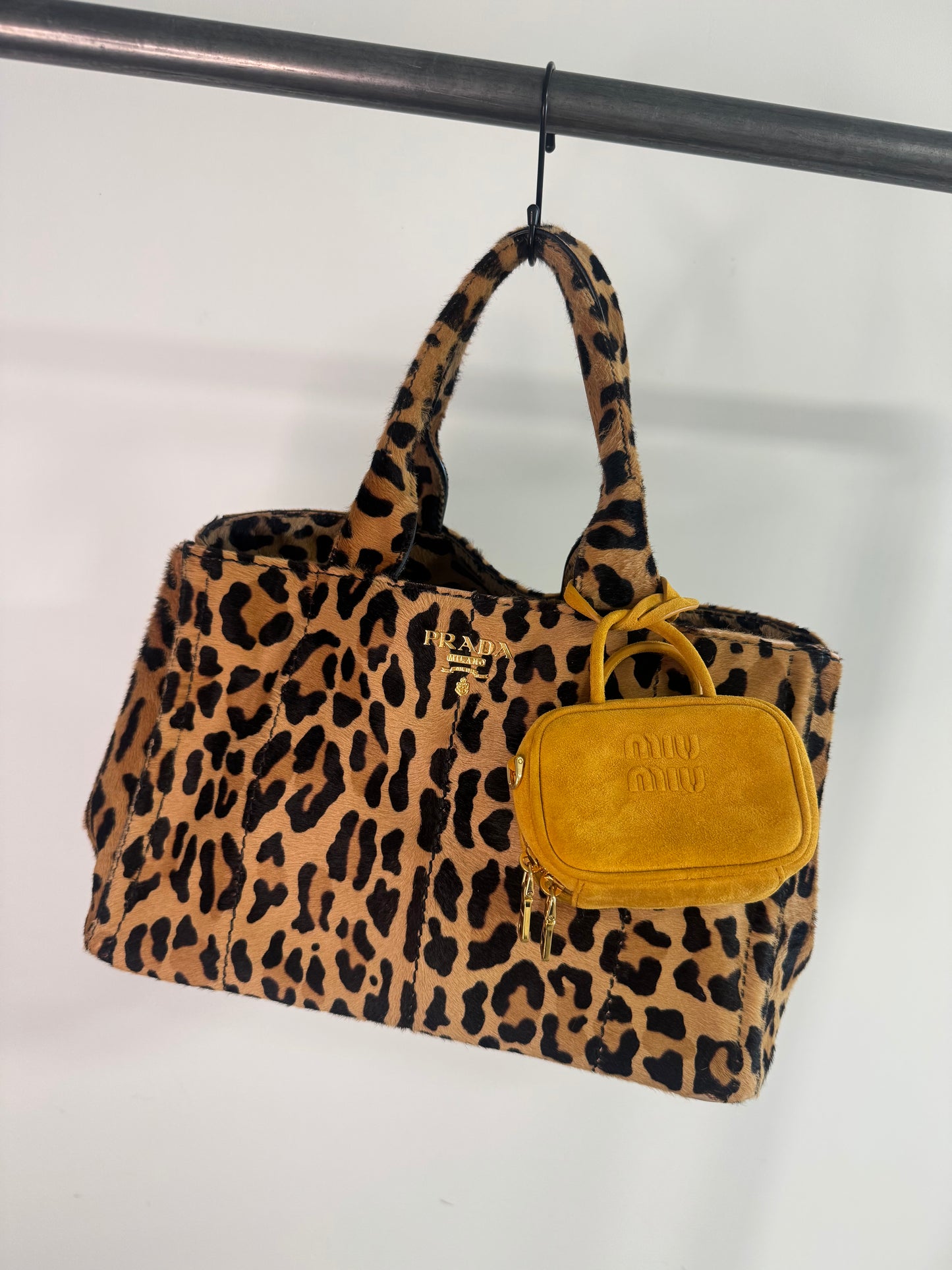 Miu Miu Beau Micro Suede Bag - Whiskey modeled as bag charm