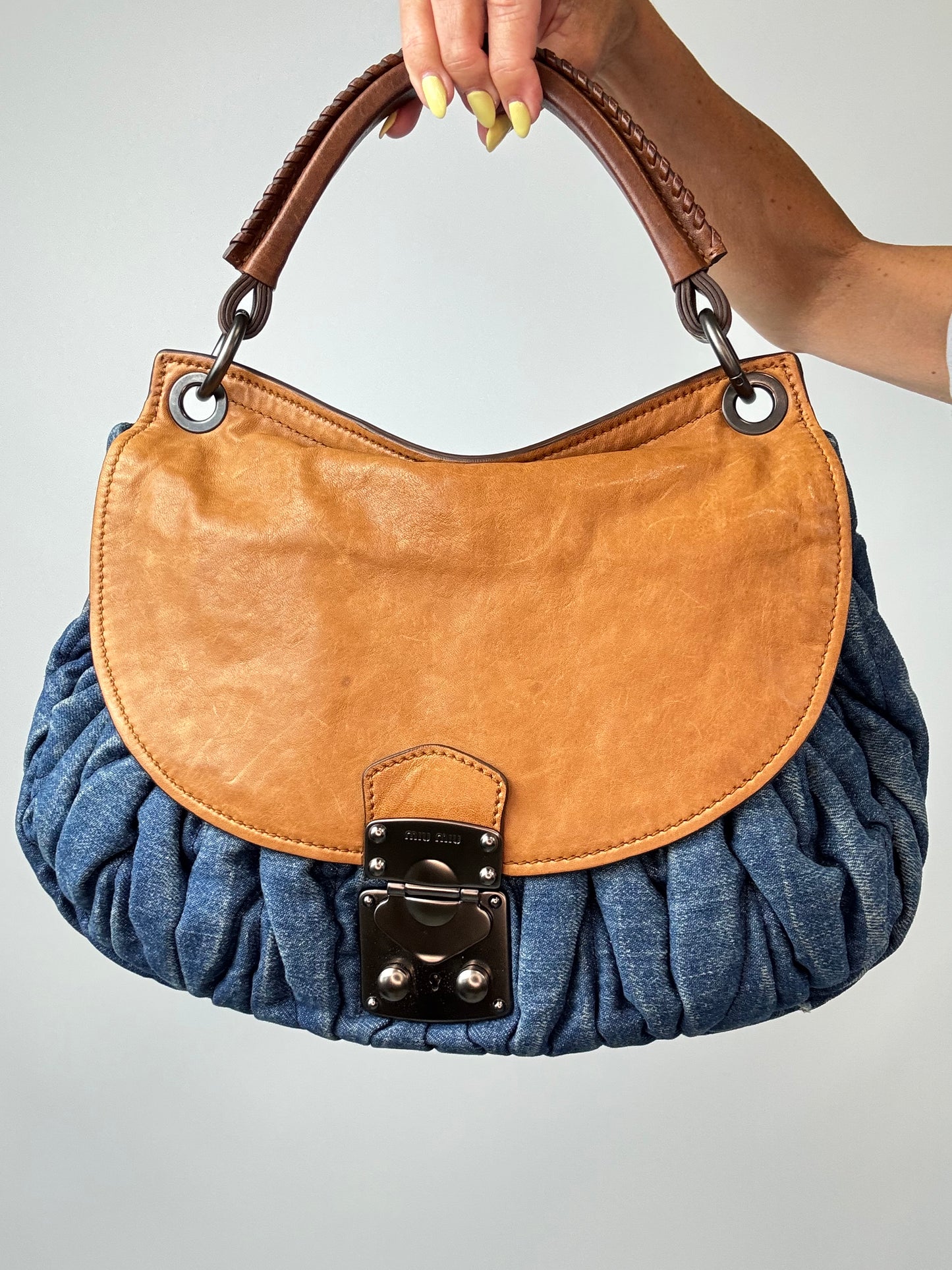 Miu Miu Blue & Brown Matelasse Denim and Leather Hobo front of handbag close up