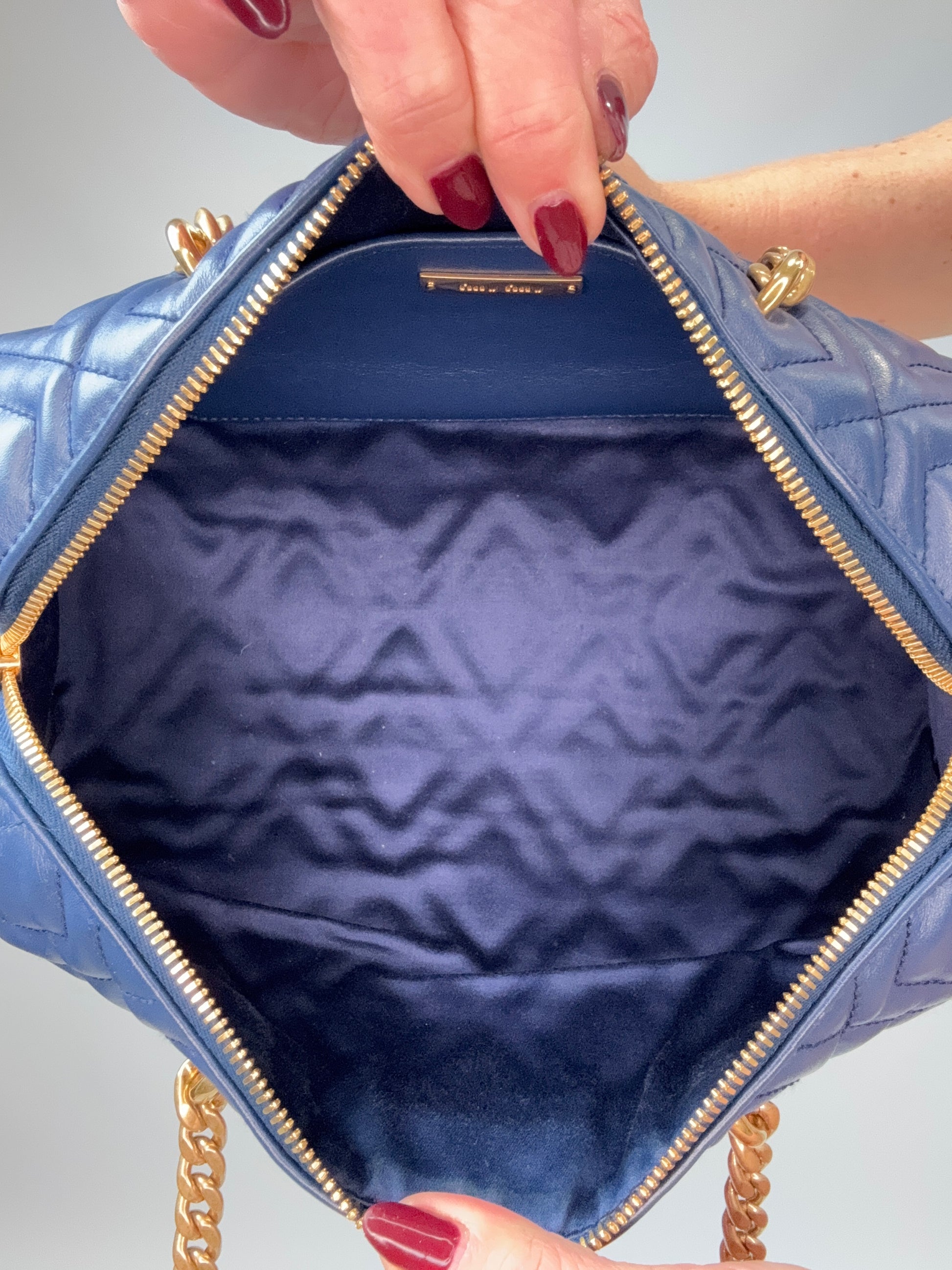 Miu Miu Diamond Quilted Cylinder Bag in Blue interior of handbag